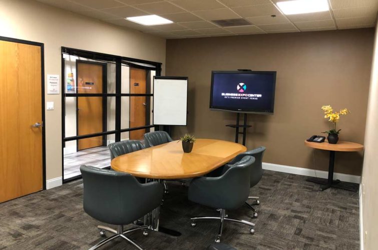 executive room used for business meetings with tv screen for projection