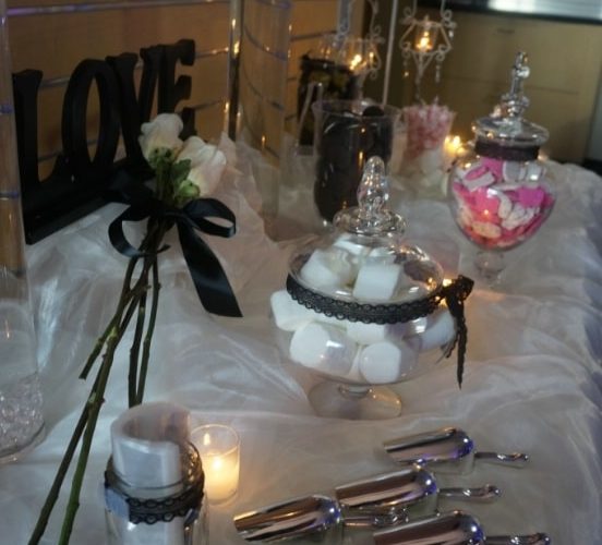 candles, flowers, and decorations on the table at the wedding event