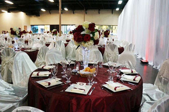 tables and chairs setting for the wedding event