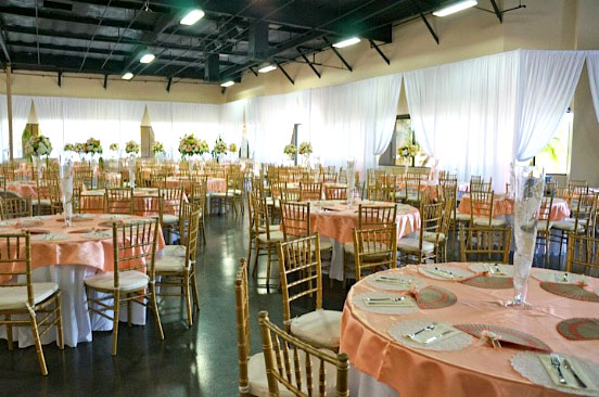 tables and chairs setting for the wedding event
