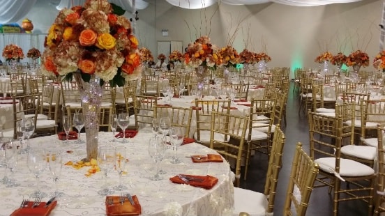 tables, chairs, flowers at the wedding event