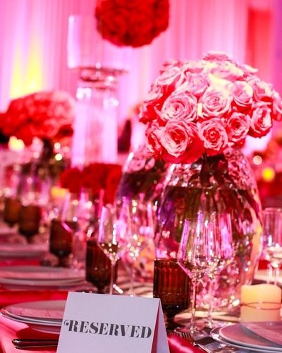 reservation sign, flowers, and plates setting on the table at TSE Wedding Gala 2015