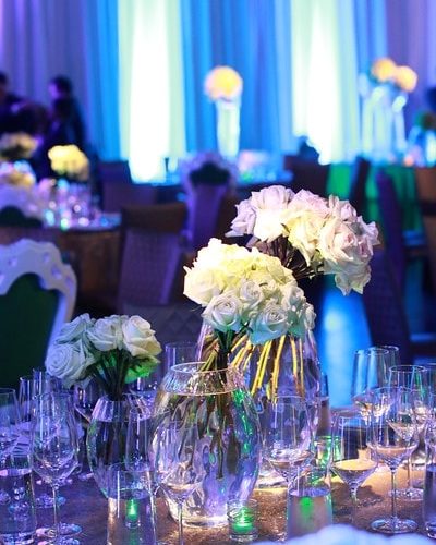 flowers and wine glasses on the table at TSE Wedding Gala 2015