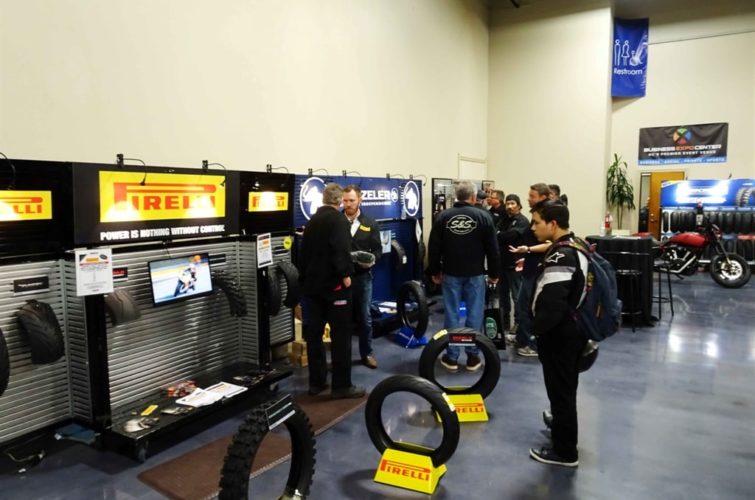 people looking at motorcycle tires at Super Show Expo