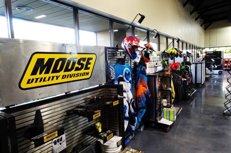 exhibiting motorcycle riding suits, helmets, and other equipment at Super Show Expo