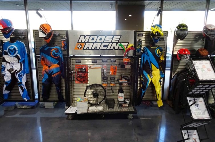 exhibiting motorcycle riding suits, helmets, and other equipment at Super Show Expo