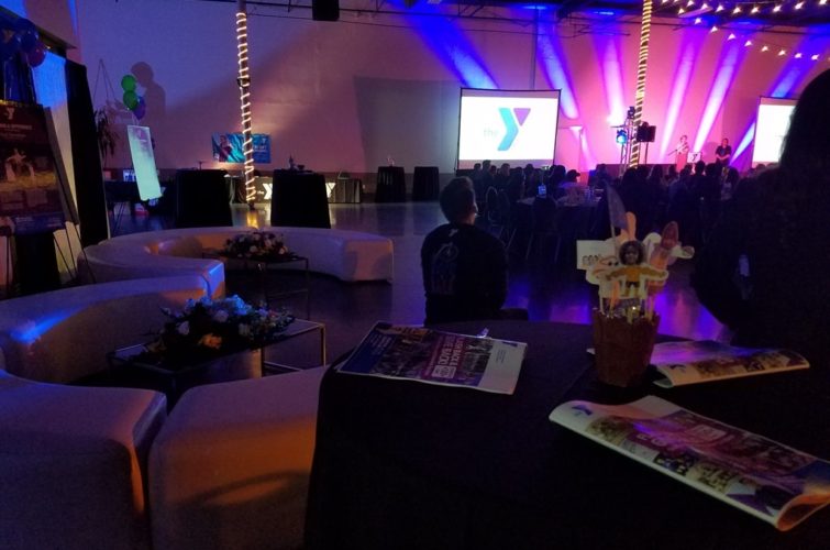 sofas and people sitting at the table at YMCA Banquet