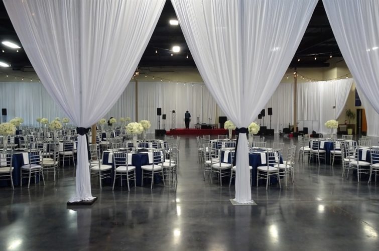 tables, chairs, flowers, curtains at the wedding event