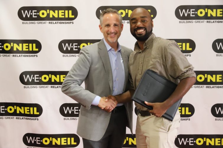 two people shaking hands at the W.E O'Neil Award Ceremonies