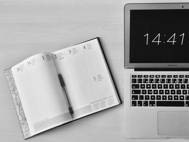 Manage your time with a planner and computer