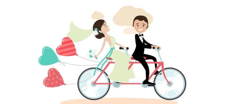 Newly married couple rides a tandem bicycle. 