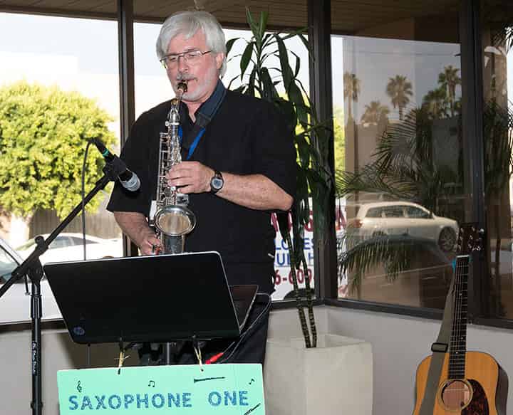 A man playing Saxophone at CaterCon